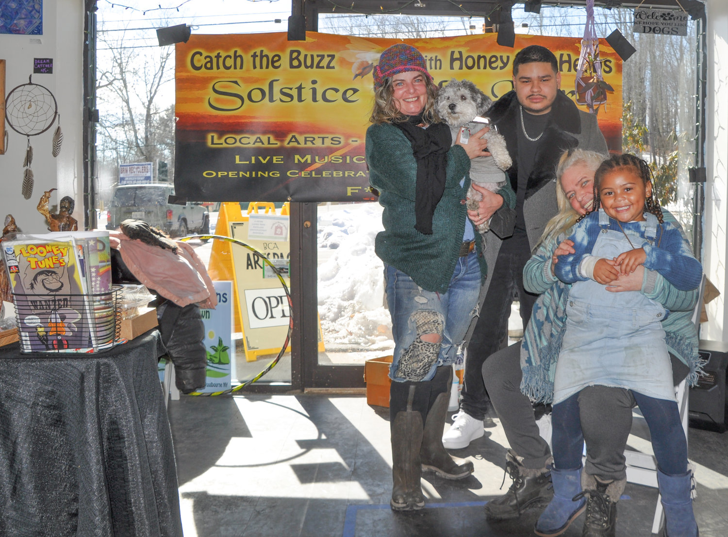 "Our goal" says Solstice Indie Mart creator Kelley Edkins, left, "is to create a space for local artists, makers and musicians of the Catskill Mountains, honoring the peace, love and hippie vibe of the Woodstock generation." Here Edkins is pictured with some of her crew—Justice Mazzotti, Indie Mart supervisor Tami Edkins Swanson, three year-old Kaleigh and the ever-present Dharma the Wonder Dog.